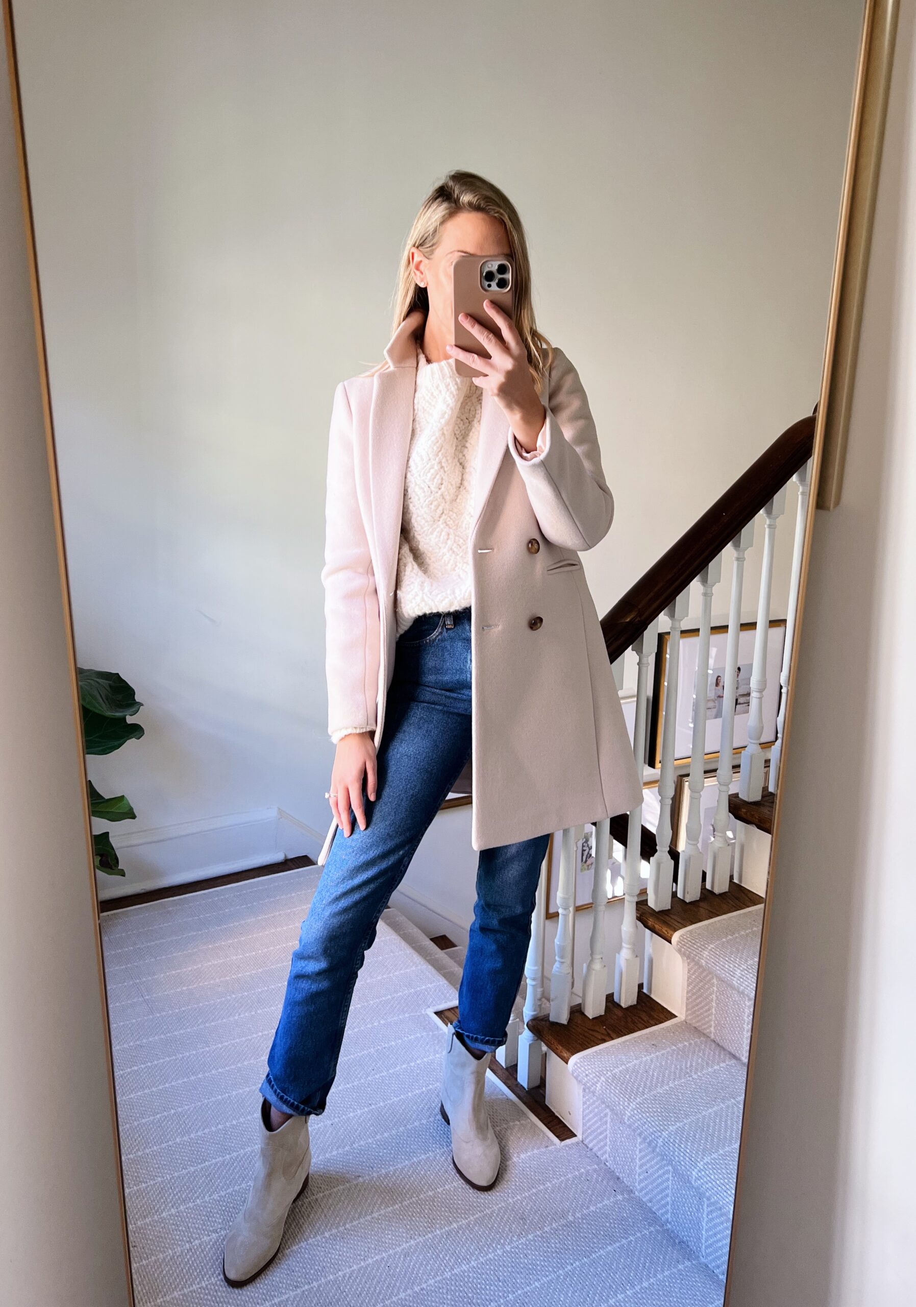 woman wearing white Sézane Knits and coat woman wearing white Sézane Knits and coat