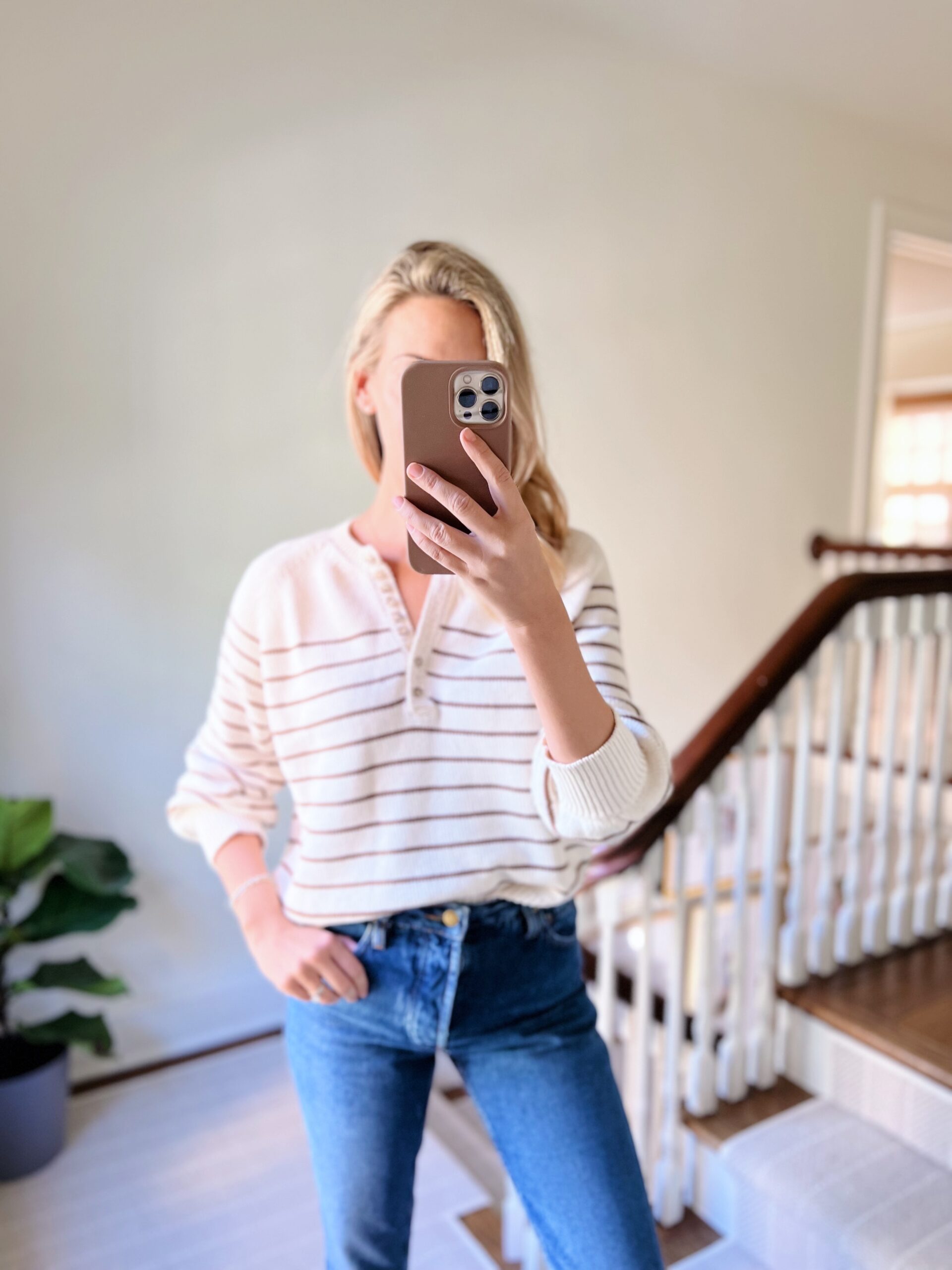 woman wearing striped Sézane Knits and jeans woman wearing striped Sézane Knits and jeans