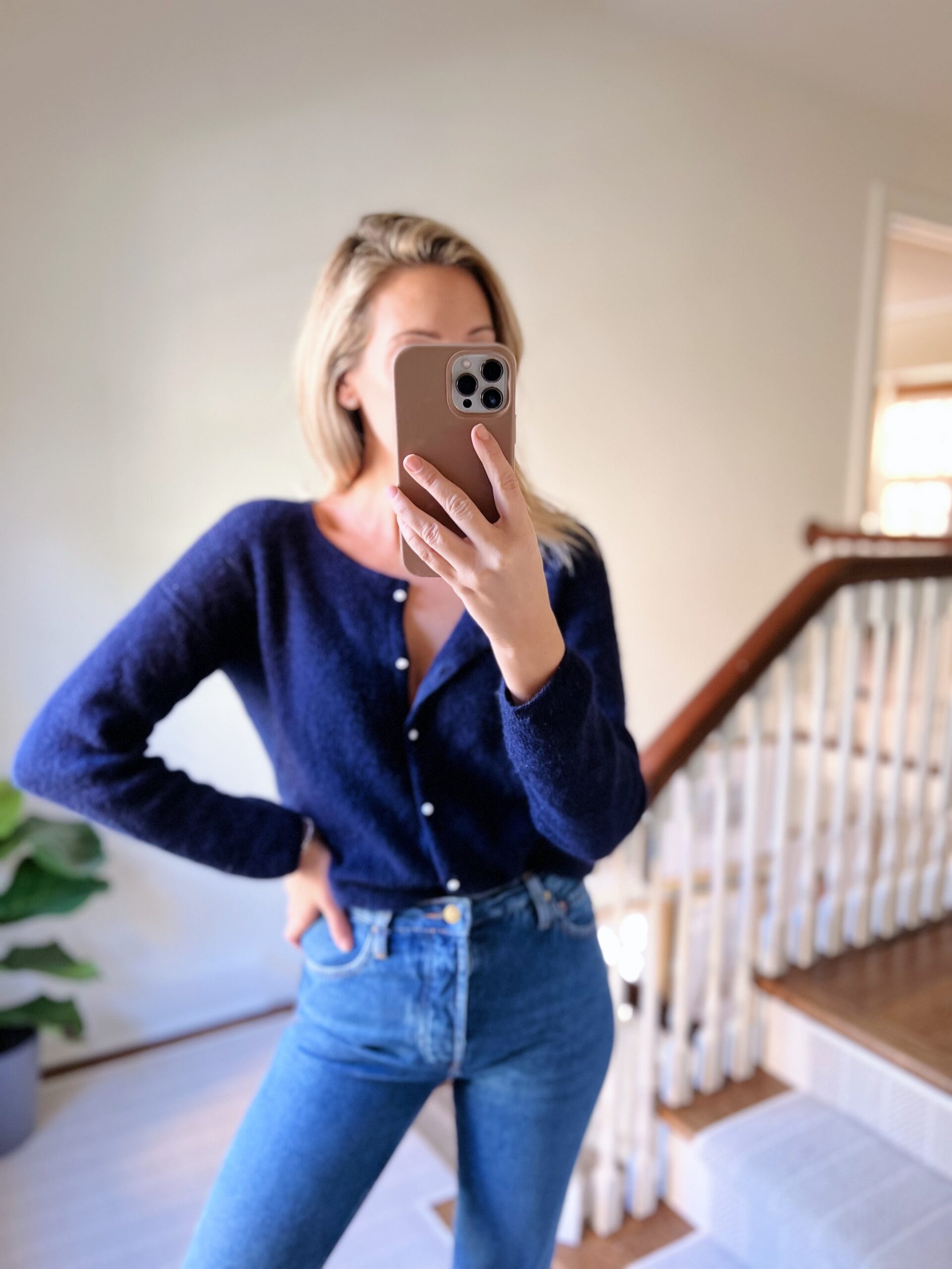woman wearing blue Sézane Knits and jeans woman wearing blue Sézane Knits and jeans