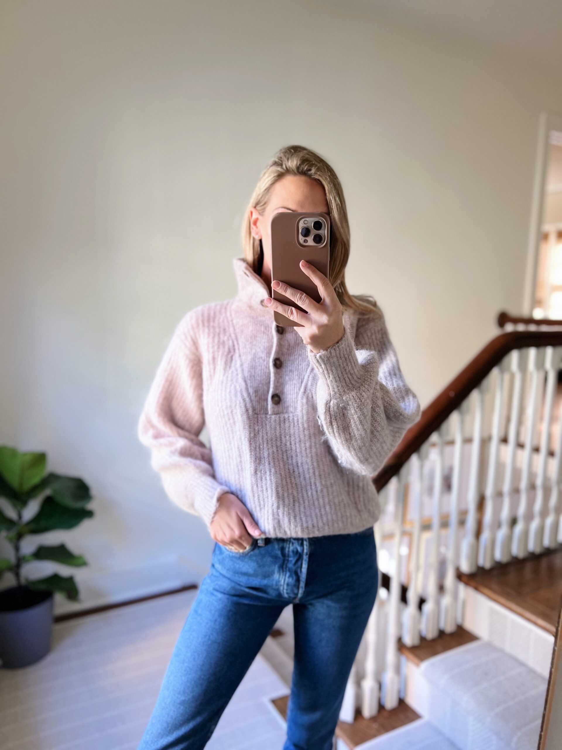 woman wearing sweater and jeans woman wearing sweater and jeans
