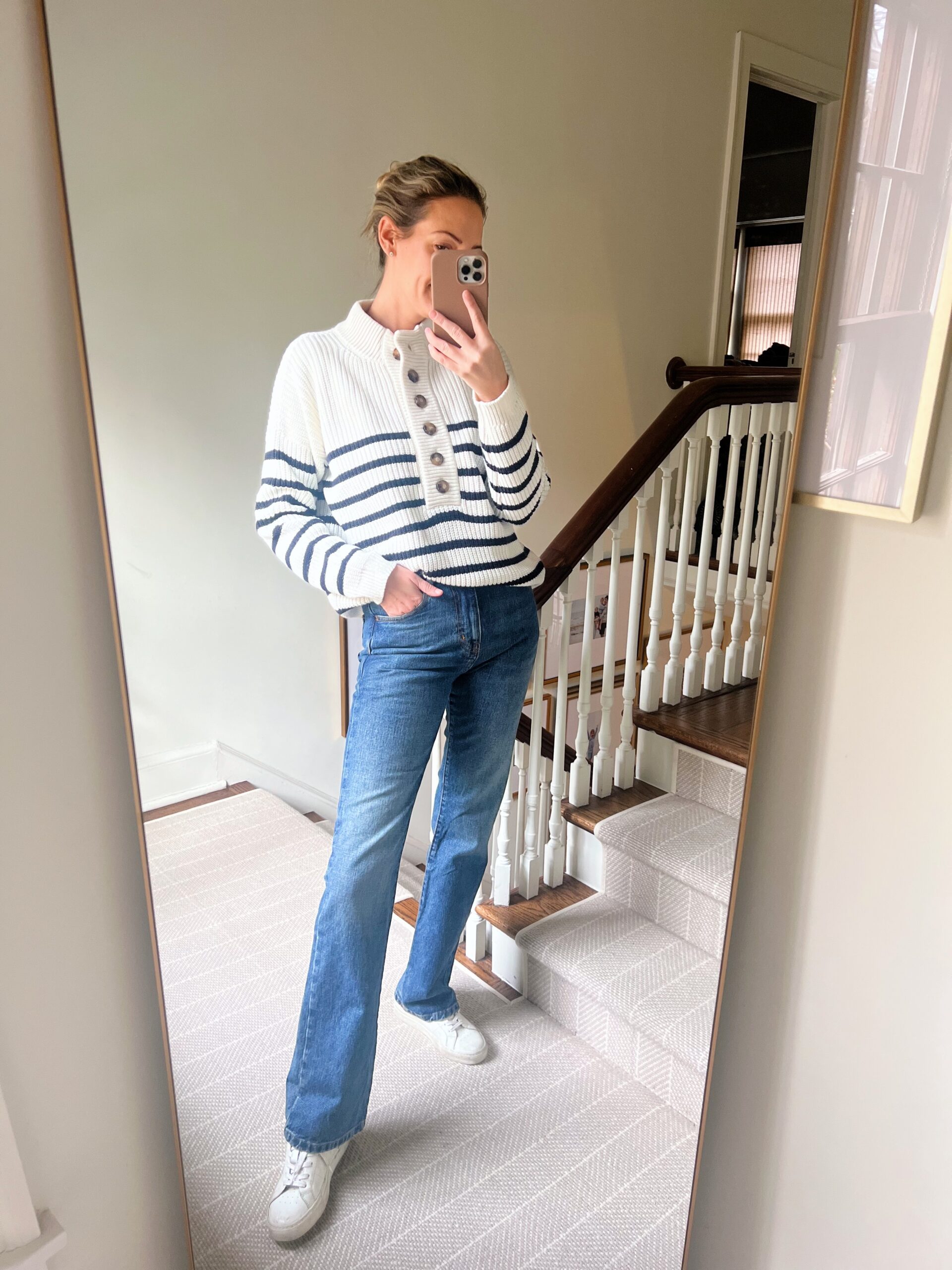 woman wearing January Refresh with Sézane black adn white sweater down and pants woman wearing January Refresh with Sézane black adn white sweater down and pants