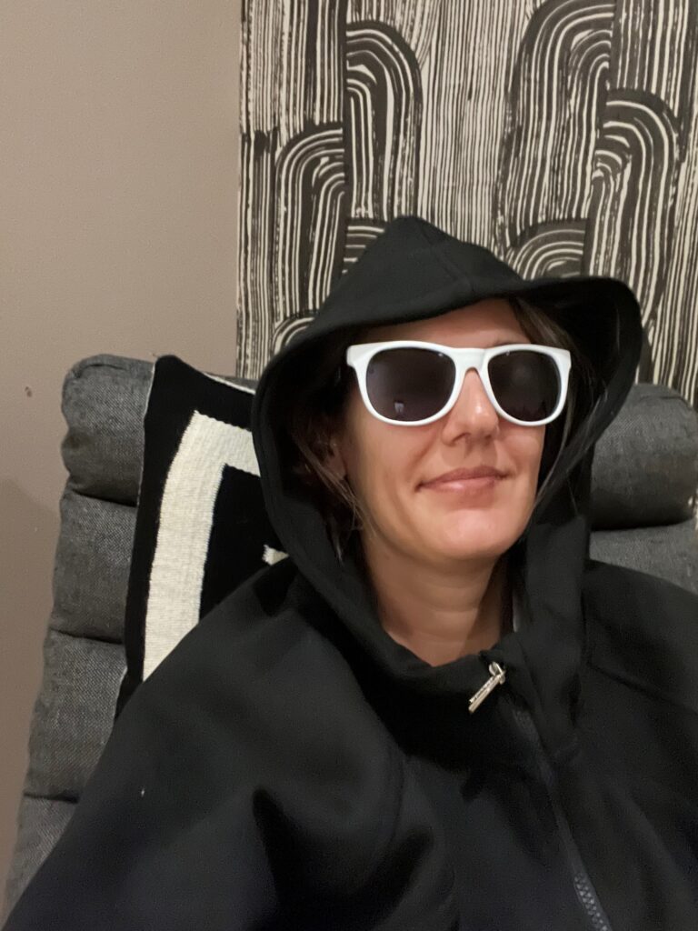 woman with EVO ICL wearing hooded jacket woman with EVO ICL wearing hooded jacket
